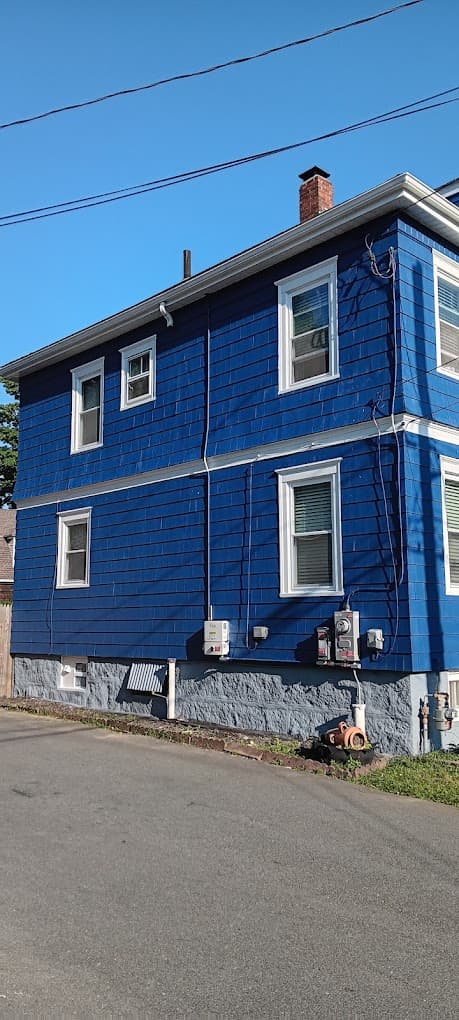 Dark blue residential exterior painting completed in New Bedford - NG Painting Pro quality work
