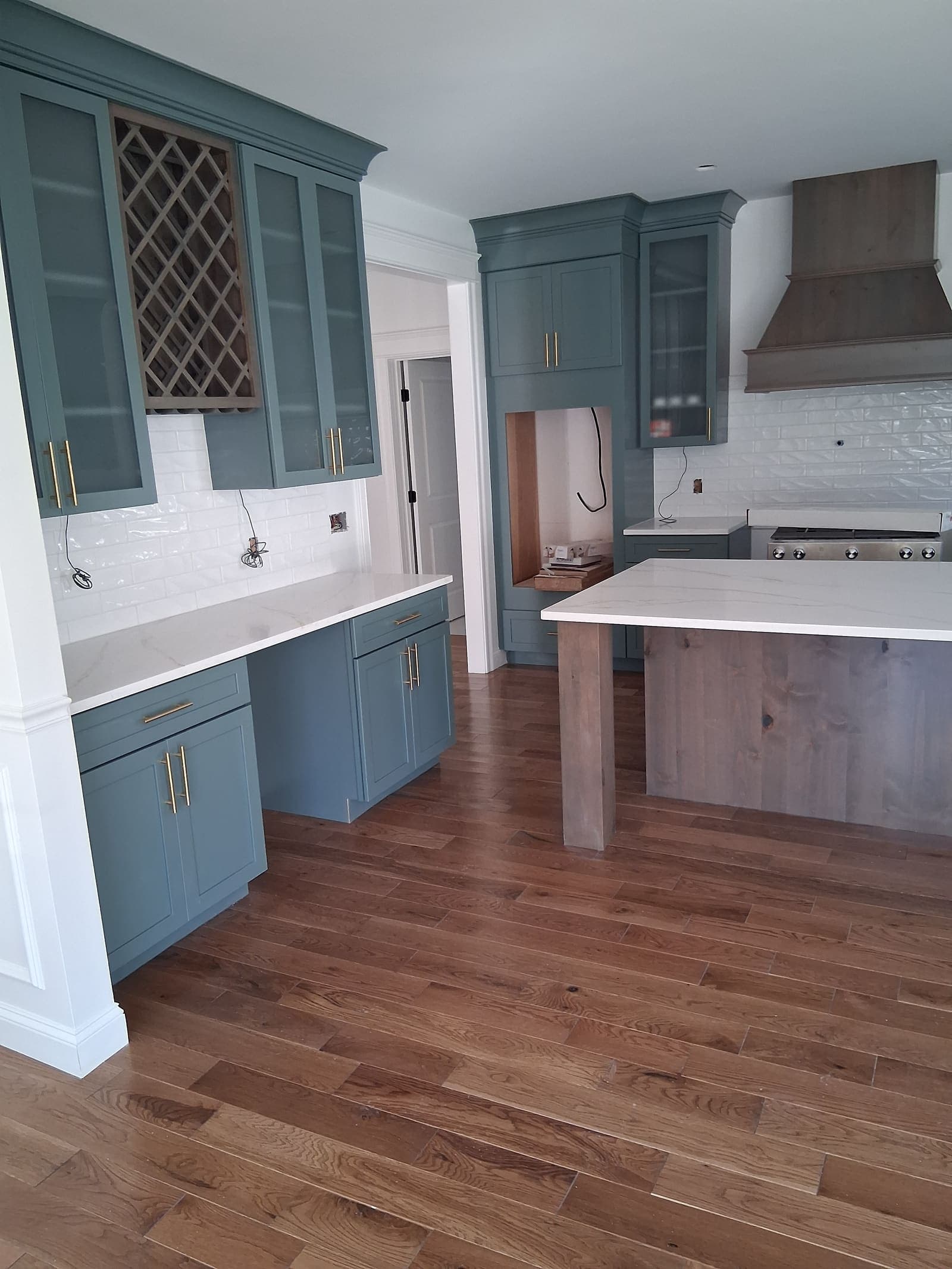 Kitchen cabinet painting with blue finish in Massachusetts home - interior painting services