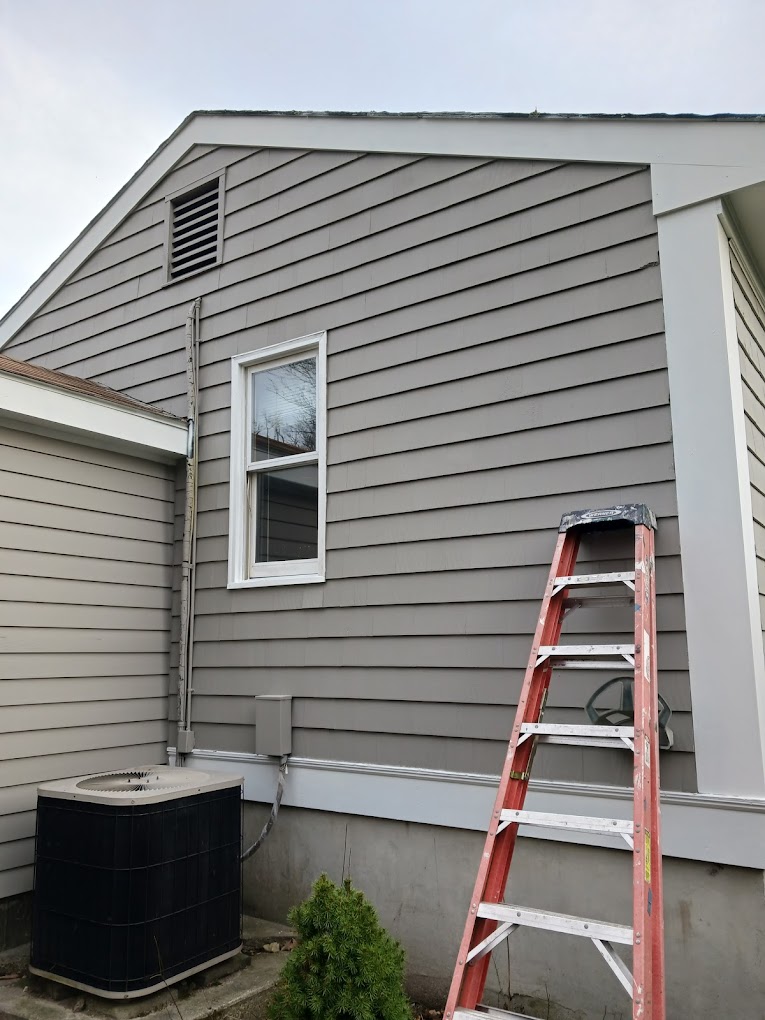 Gray exterior painting in progress