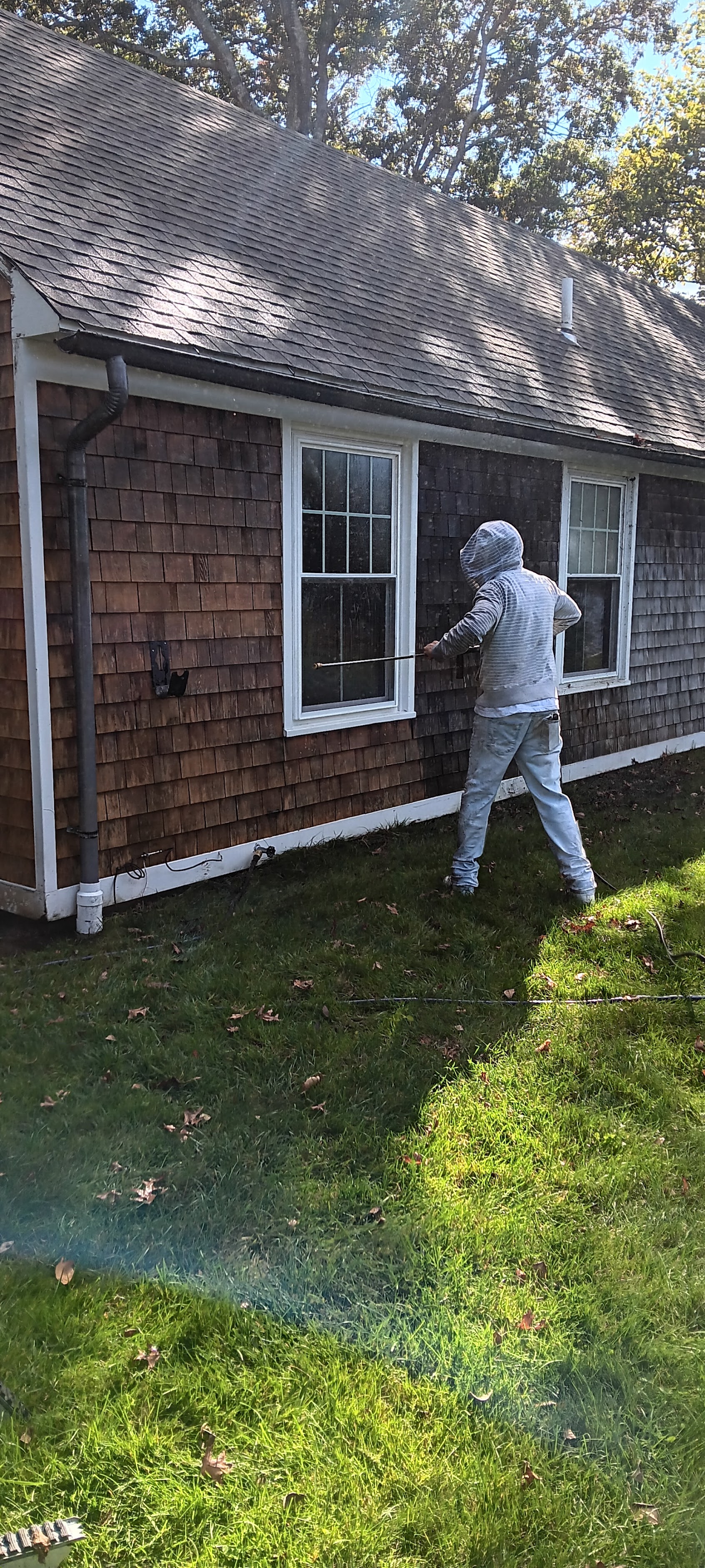 Professional pressure washing cedar shingle siding